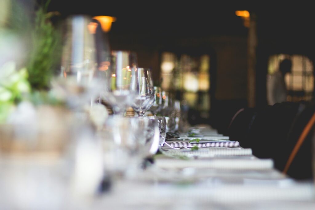 Elegant event table setting with candles and fine dining decor