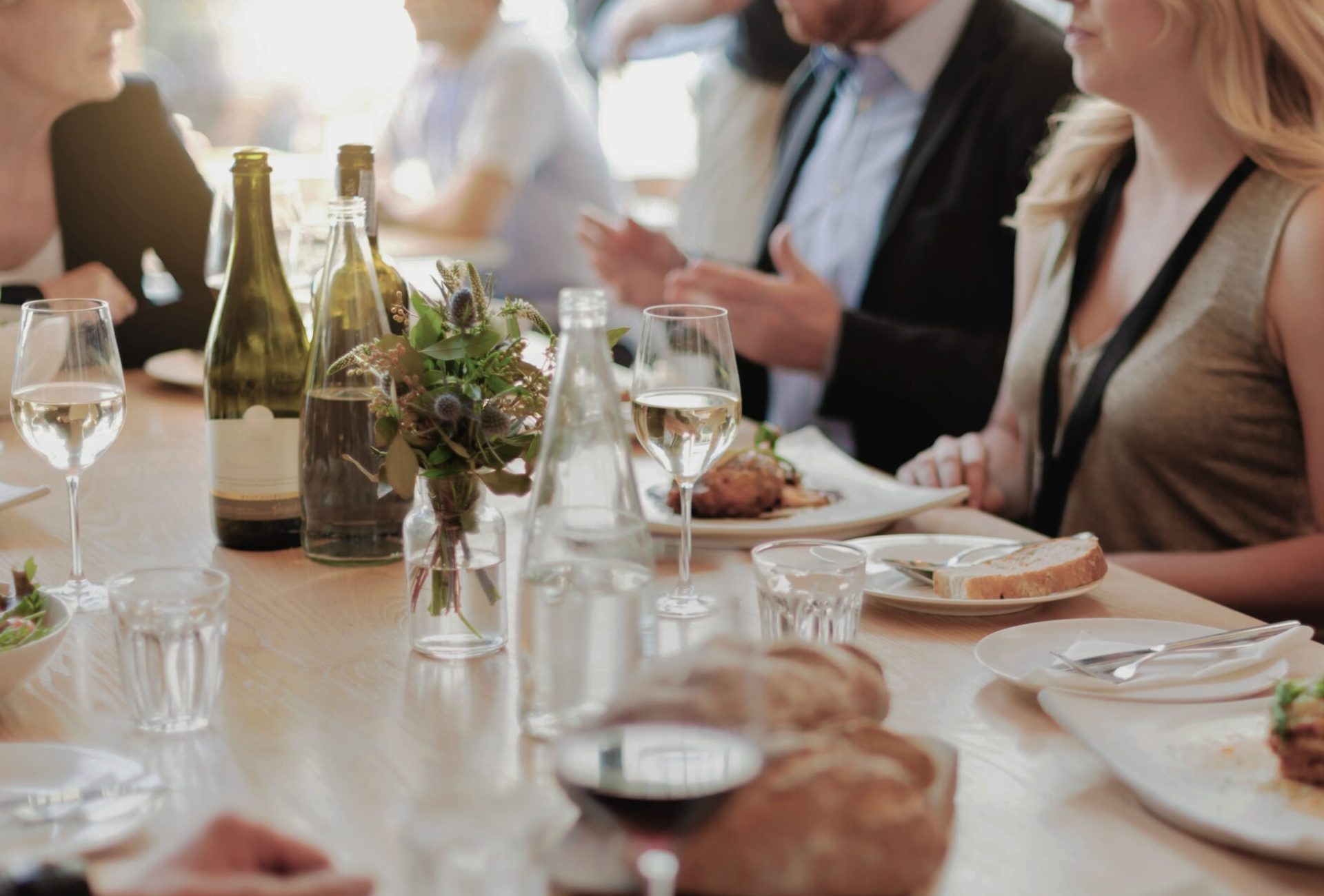 Guests enjoying wine and dinner at a catered private event